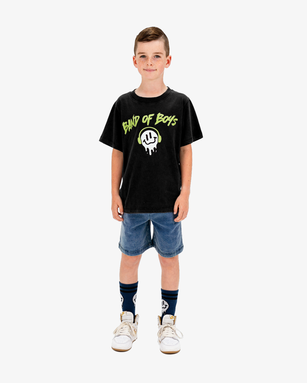 Child wearing a black t-shirt with 'Band of Boys' logo on a white background