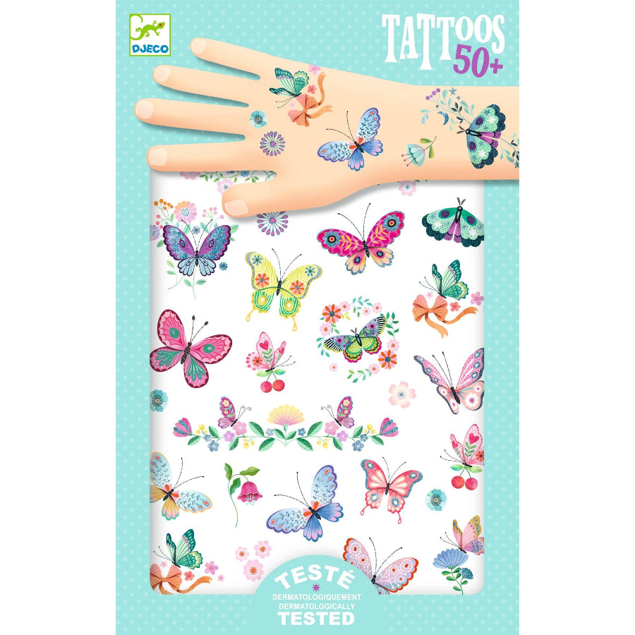 Packaging of butterfly tattoos with a hand model on a light blue background