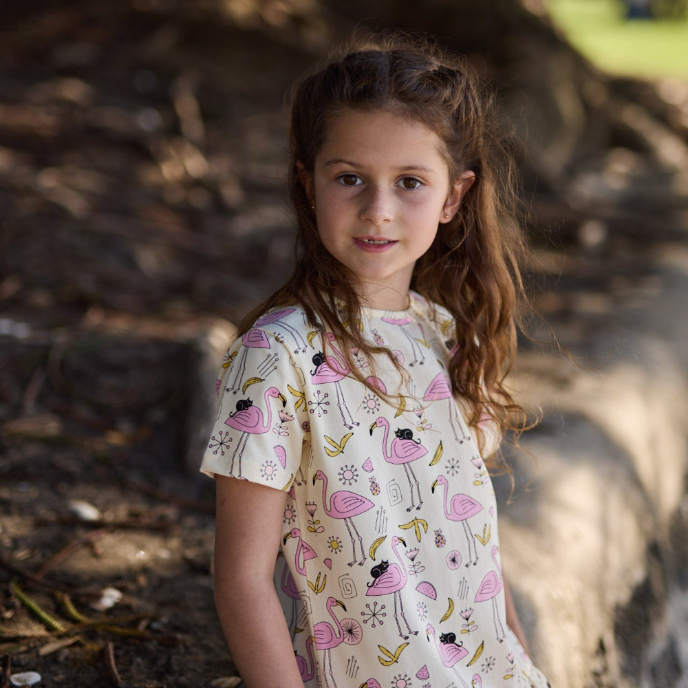 Short-sleeve shirt with flamingo pattern on a white background