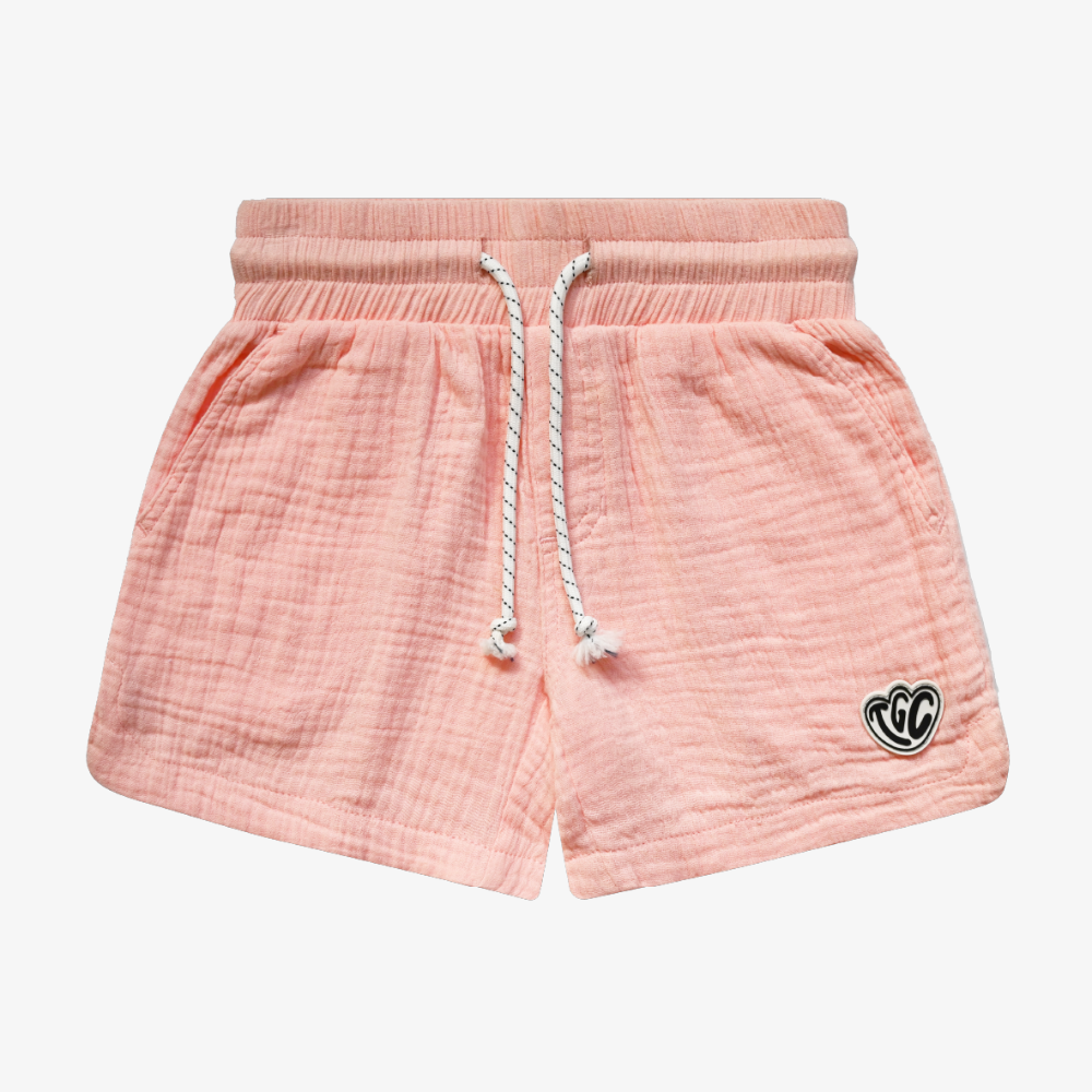 Pink shorts with a drawstring on a white background