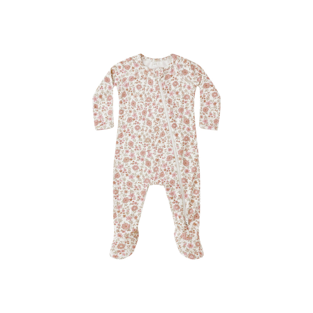 Floral patterned baby onesie on a white background