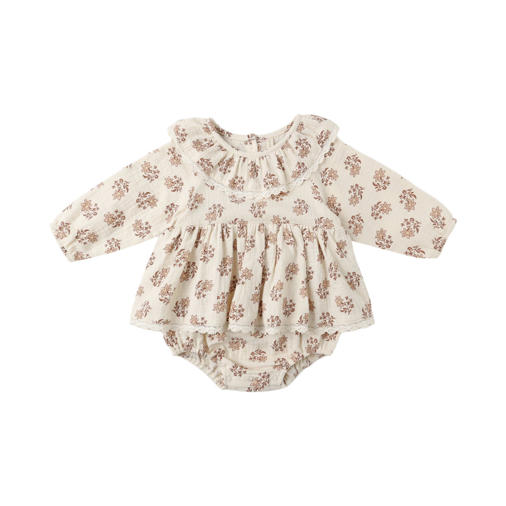 Floral baby romper on a white background
