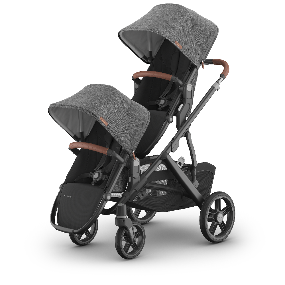 Double stroller with gray canopies and brown handles on a white background