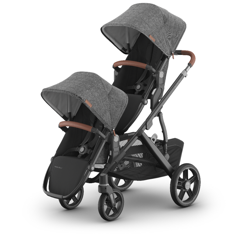 Double stroller with gray canopies and brown handles on a white background
