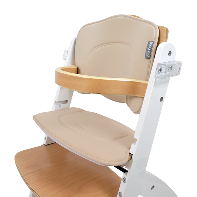 Wooden high chair with beige cushion on a white background