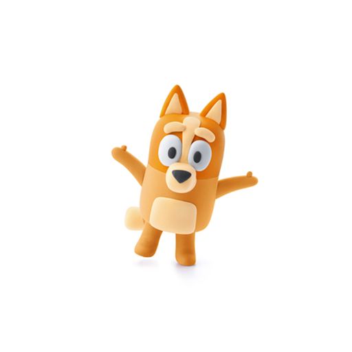 Toy figure of a dog with a happy expression on a white background