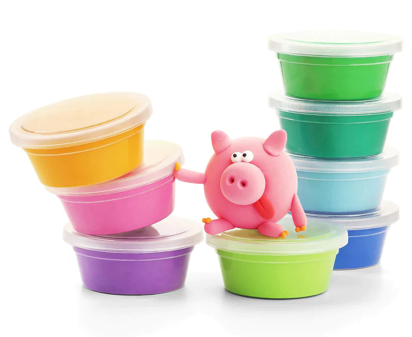 Colorful stackable containers with a pink pig toy on a white background