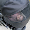 Baby in a stroller with a blurred background