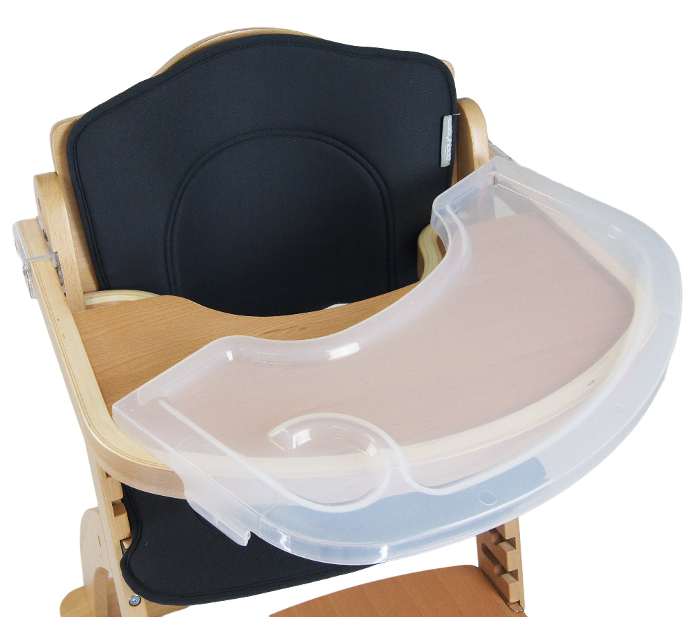 Child's high chair with a black cushion and beige tray on a white background