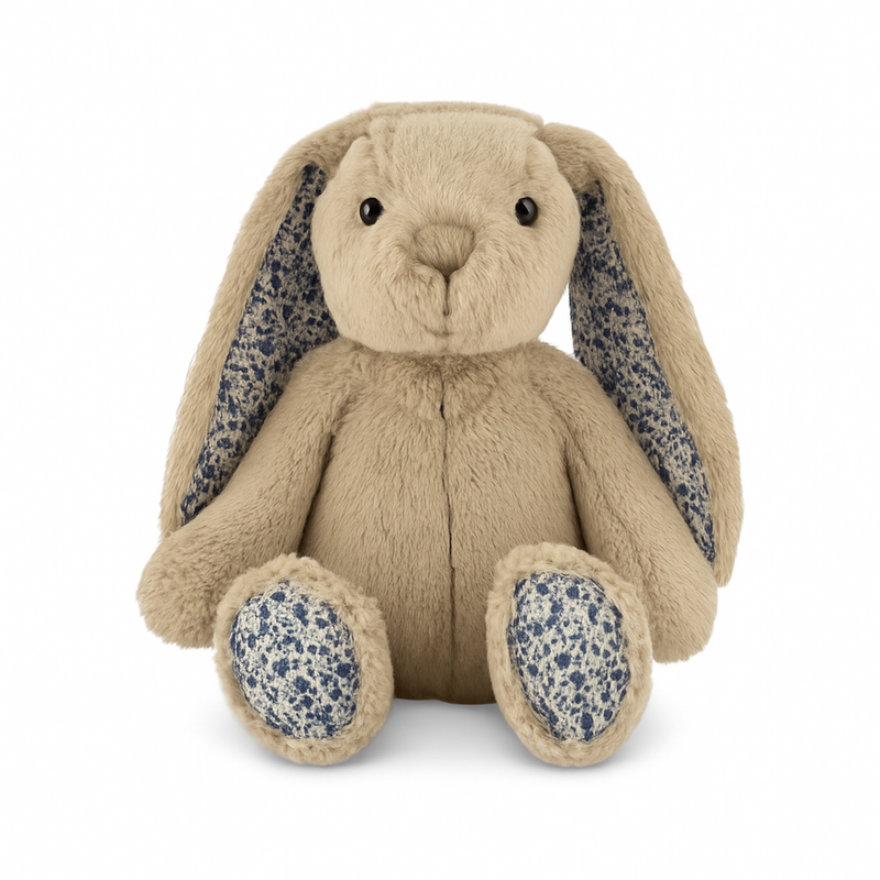 Plush toy rabbit with floral ears and paws on a white background