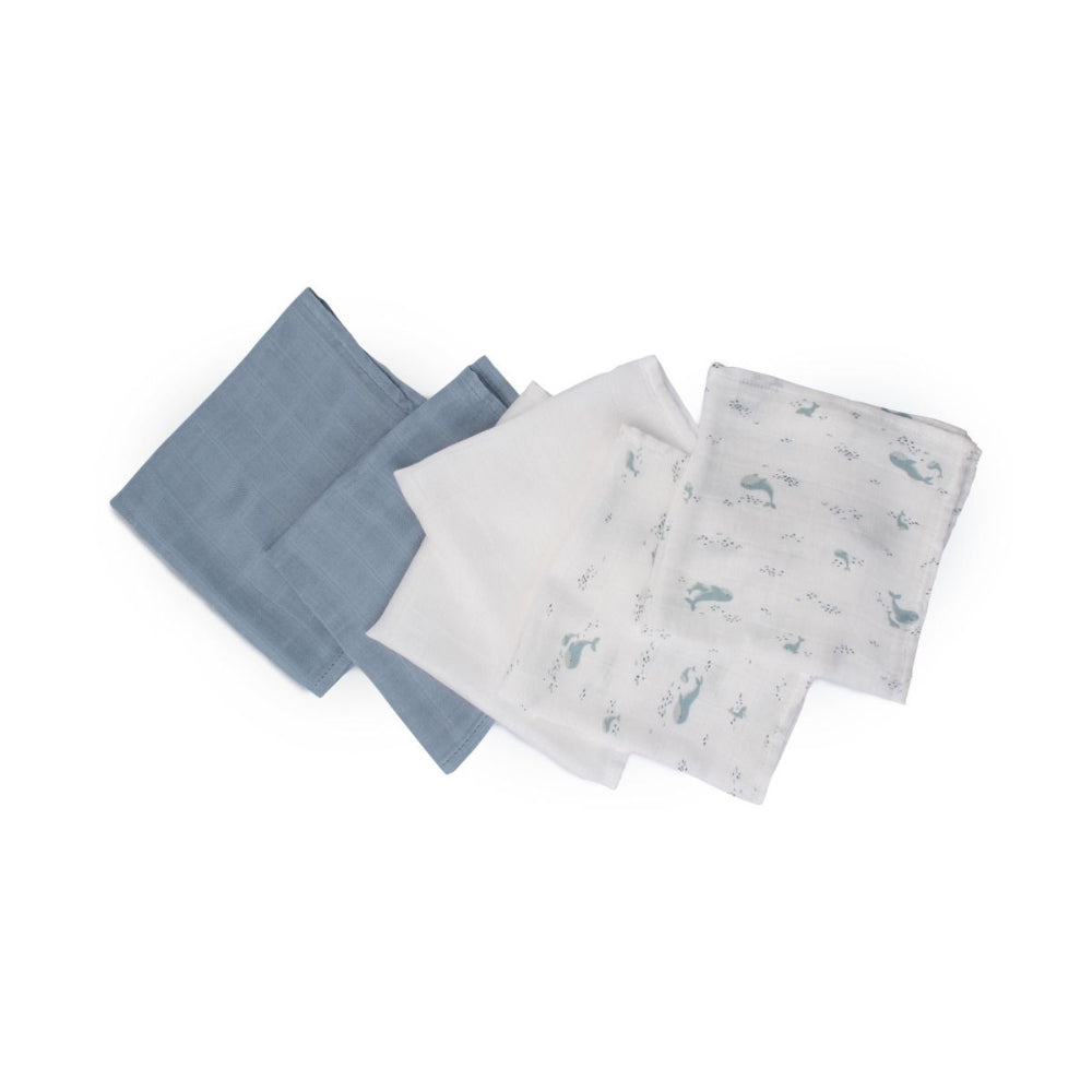 Set of muslin baby wash cloths on a white on a white background