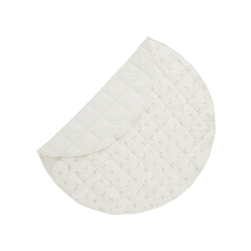Half-circle quilted pad with a subtle pattern on a white background