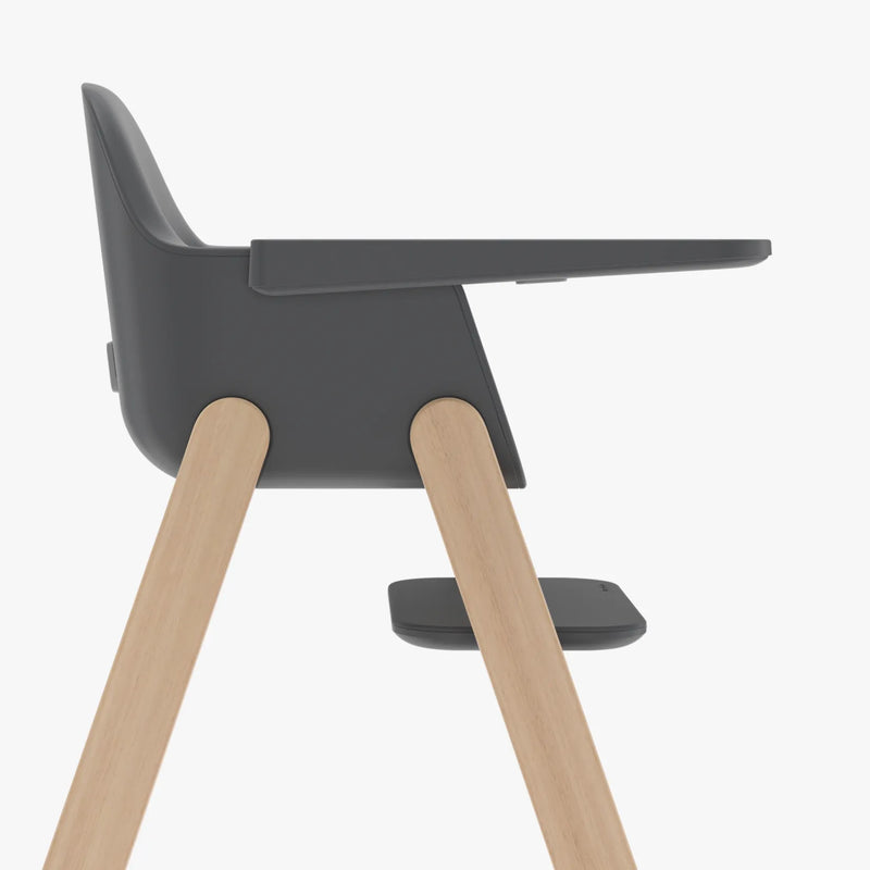 Dark gray chair with wooden legs on a white background