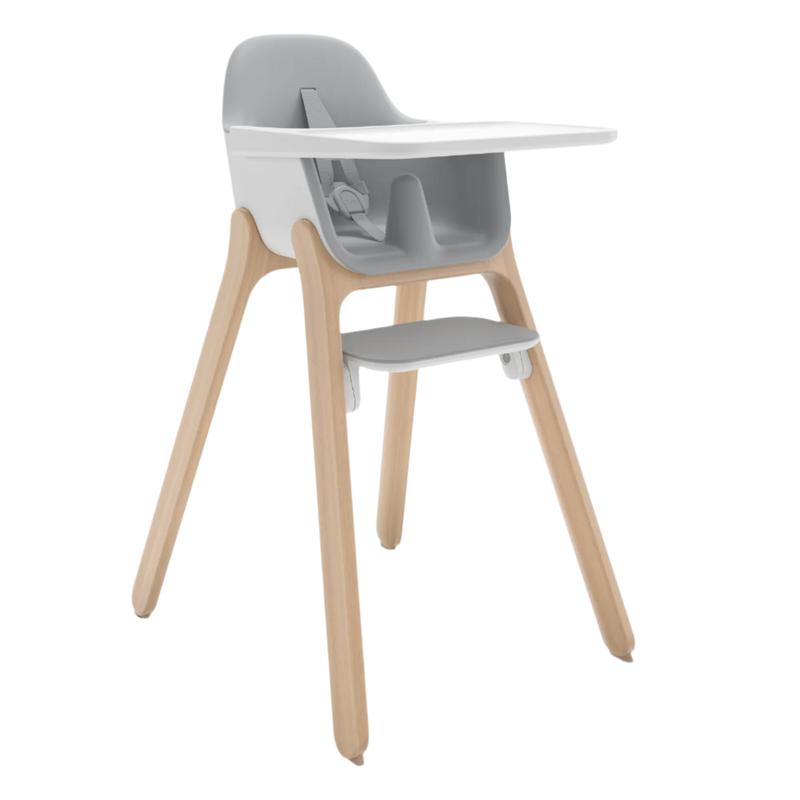 Children's high chair with gray cushioned seat and backrest, white tray, and wooden legs on a white background.