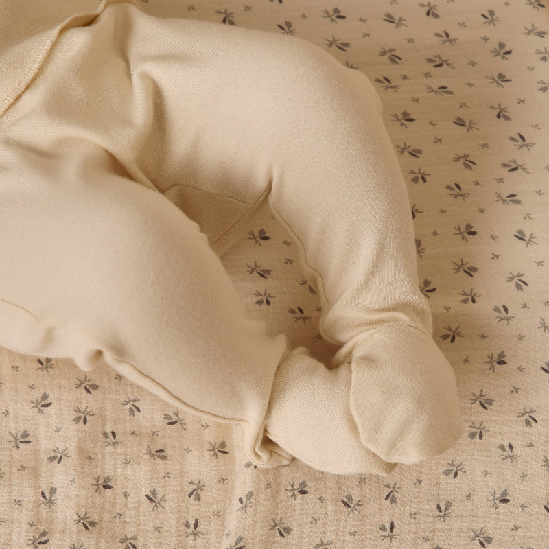 Beige fabric with a floral pattern on a matching background